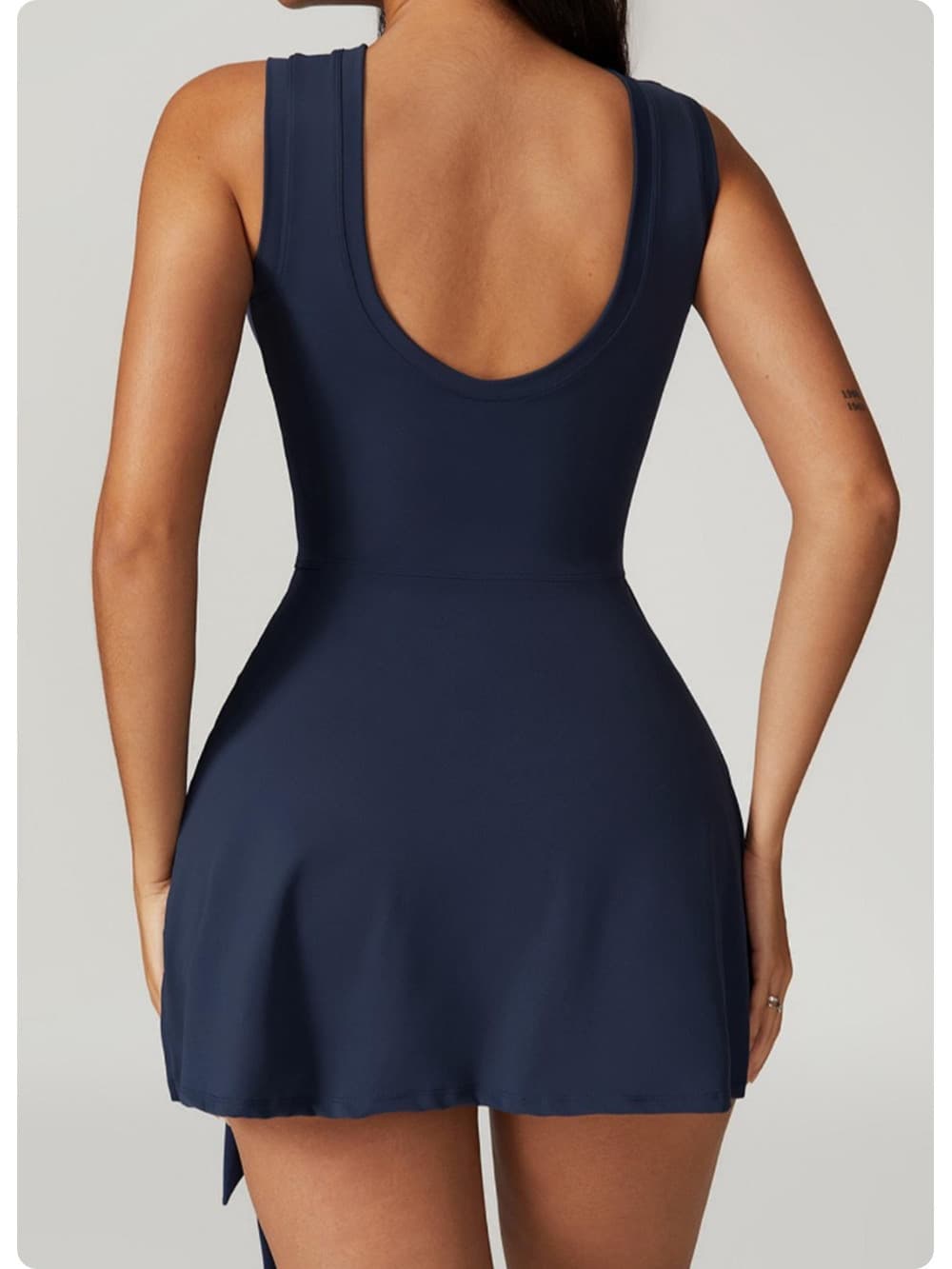 Badge Blue Wrap-Tie Court Romper with tie-side skirt 