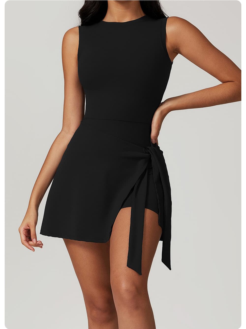 Black Wrap-Tie Court Romper with tie-side skirt design
